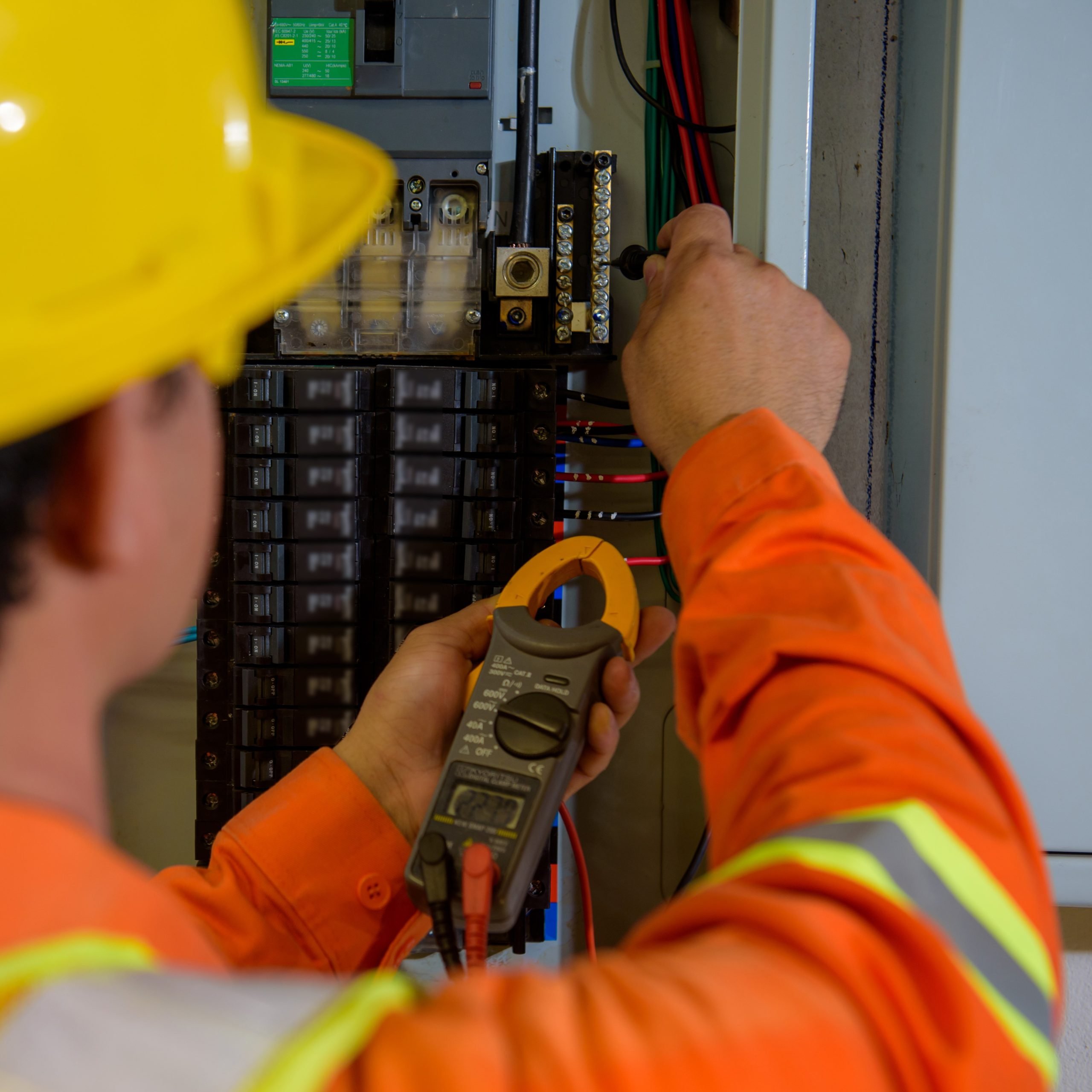 electrical engineer using tablet checking and service